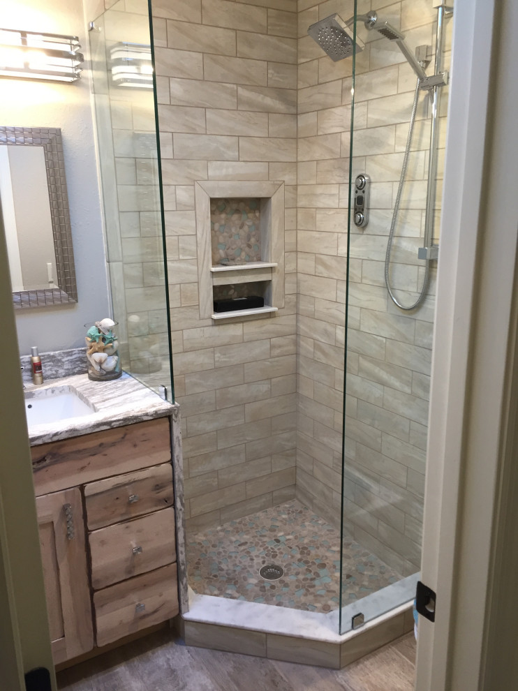 Photo of a small bathroom in Cleveland with shaker cabinets, light wood cabinets, a corner shower, a one-piece toilet, gray tile, grey walls, wood-look tile, an undermount sink, engineered quartz benchtops, grey floor, an open shower, multi-coloured benchtops and a single vanity.