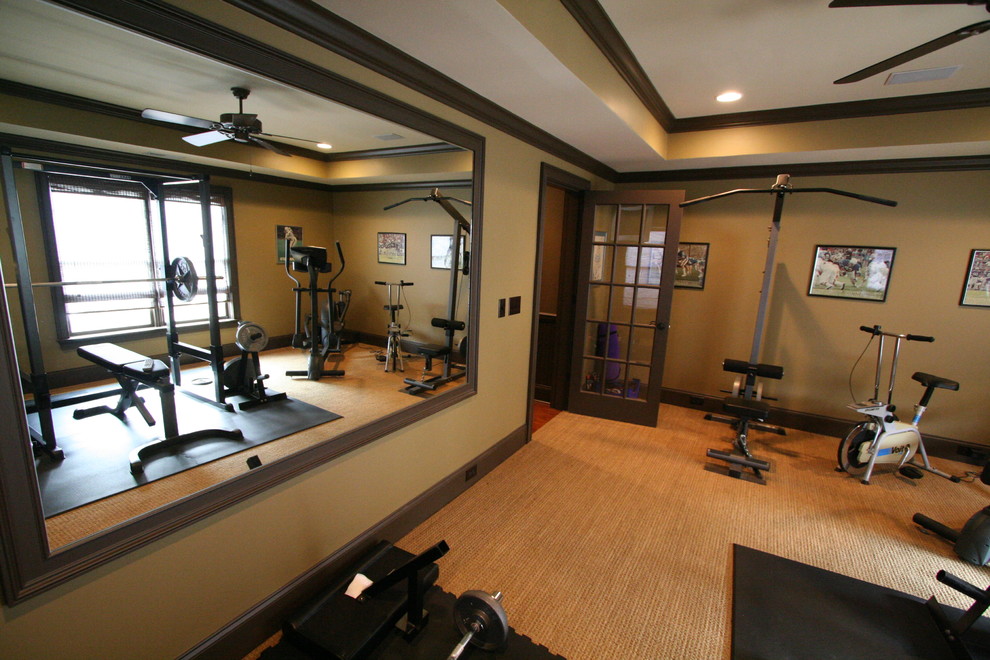 This is an example of a mid-sized country multipurpose gym in Atlanta with beige walls, carpet and beige floor.