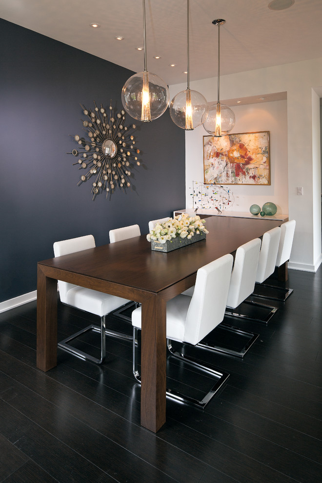 Mid-sized contemporary dining room in Indianapolis with dark hardwood floors, blue walls and no fireplace.