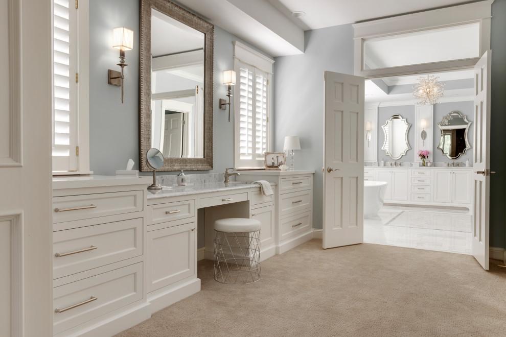 Large elegant carpeted and beige floor dressing room photo in Minneapolis with recessed-panel cabinets and white cabinets