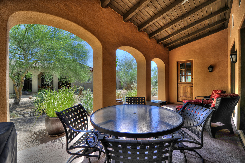 This is an example of a mediterranean backyard patio in Phoenix.