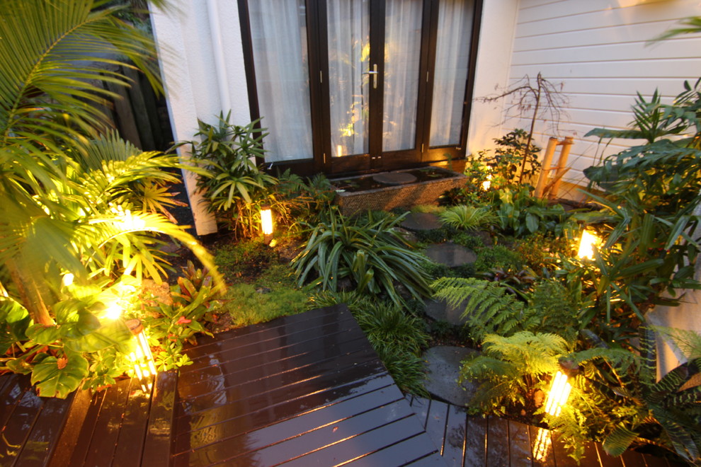 Photo of a tropical home design in Auckland.