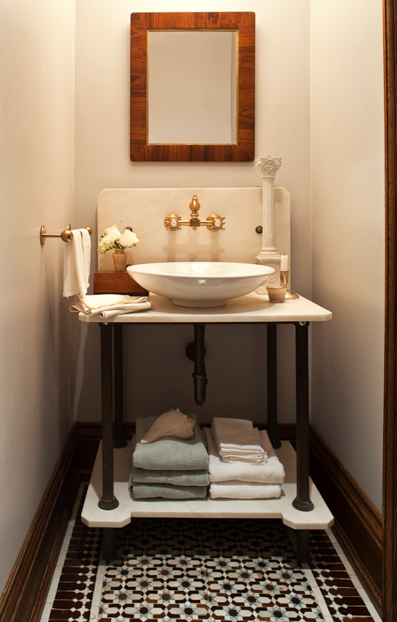 Photo of a traditional bathroom in Toronto with a vessel sink, open cabinets and mosaic tile.