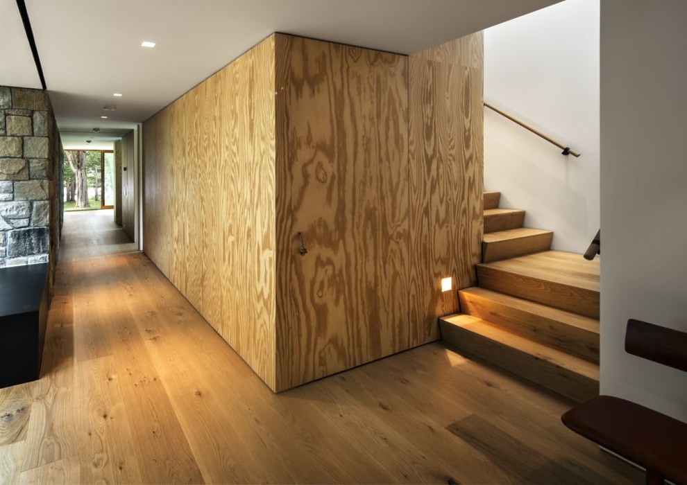 Modern wood staircase in New York with wood risers.