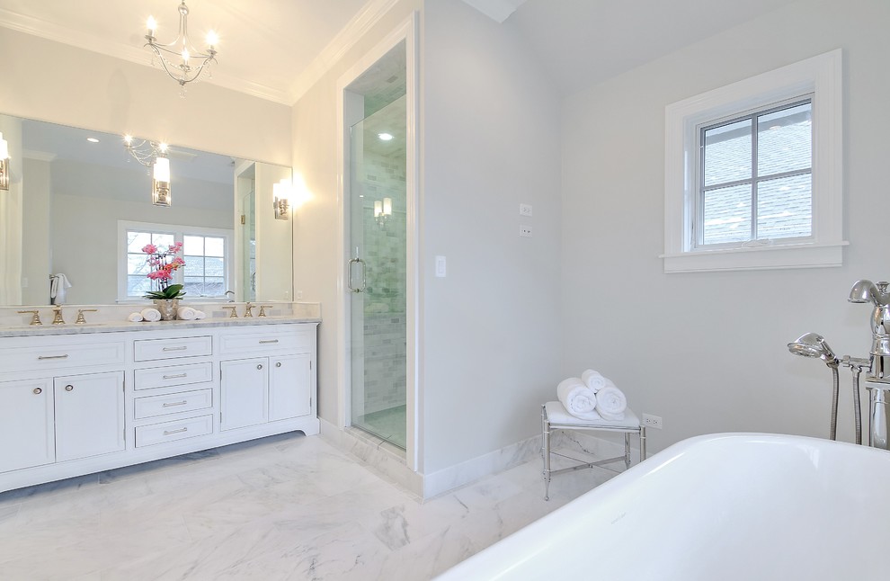 Freestanding bathtub - mid-sized transitional master gray tile and stone tile marble floor freestanding bathtub idea in Chicago with white cabinets, gray walls, an undermount sink, marble countertops and shaker cabinets