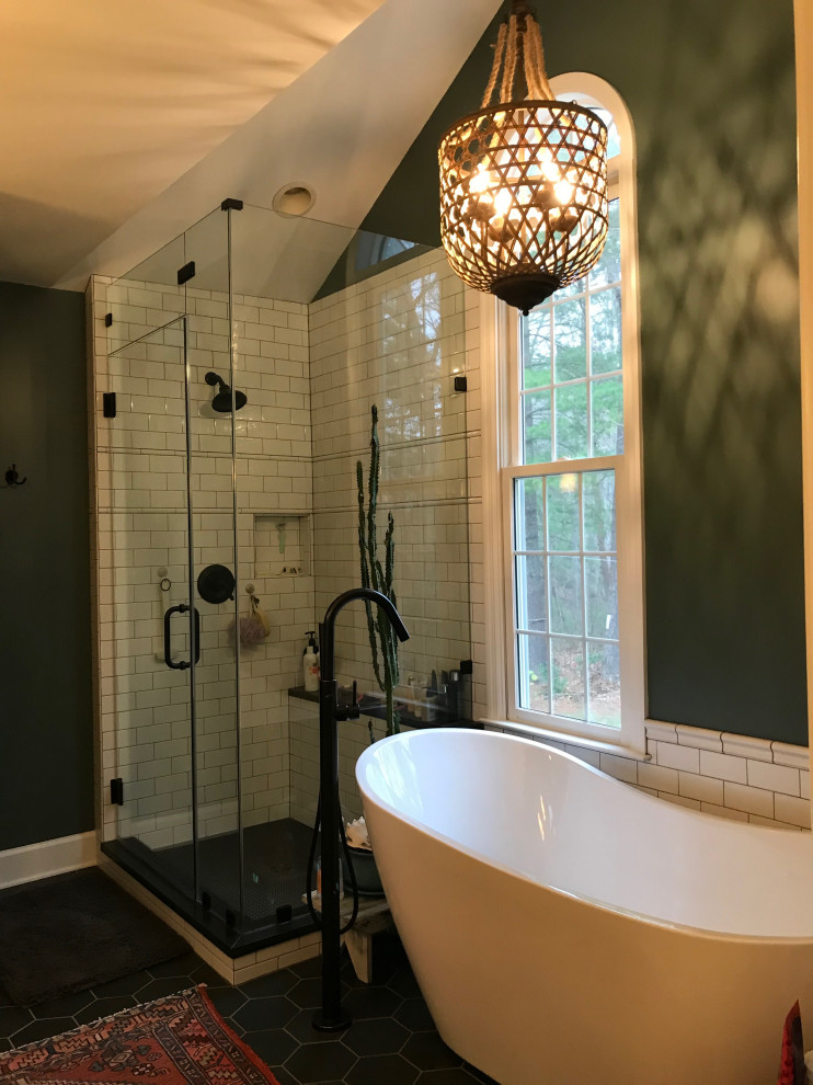 Example of a large transitional master porcelain tile, gray floor, double-sink and vaulted ceiling freestanding bathtub design with shaker cabinets, light wood cabinets, a two-piece toilet, green walls, an undermount sink, marble countertops, a hinged shower door, white countertops and a built-in vanity