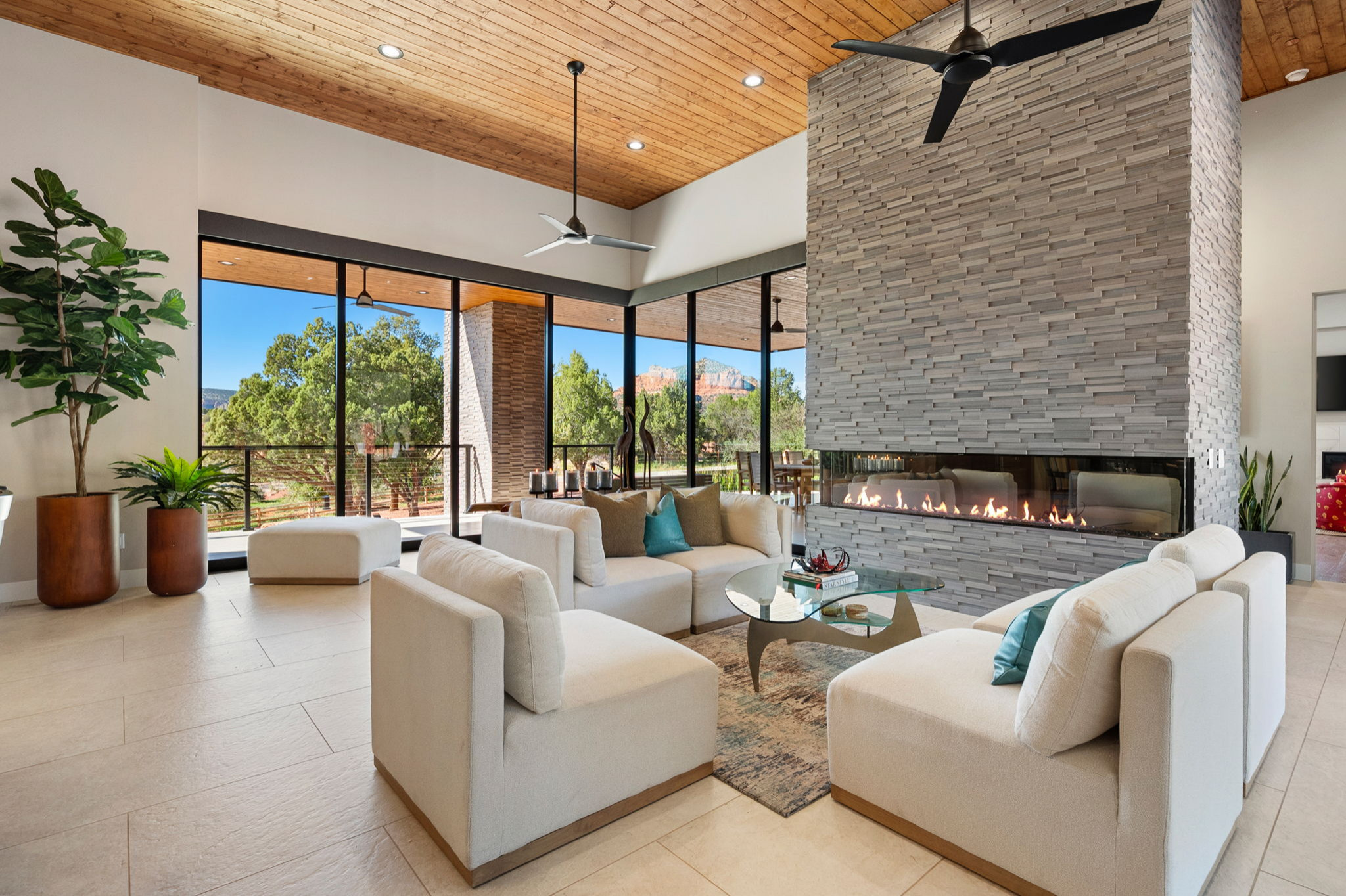 Inspiration for a contemporary open concept beige floor and wood ceiling living room remodel in Phoenix with white walls, a ribbon fireplace and a tile fireplace