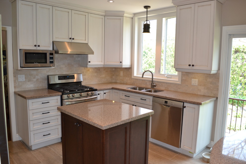 Example of a transitional kitchen design in Toronto