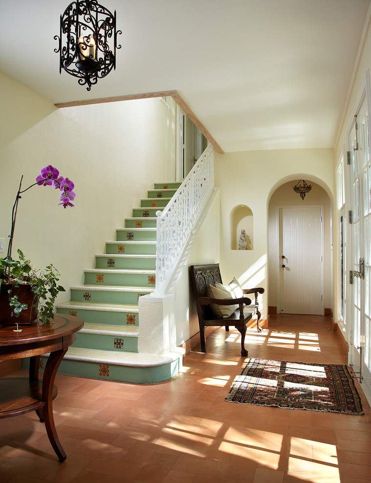 This is an example of a mediterranean entryway in Miami with beige walls.