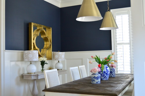 A navy wall above chair rail wainscoting is gorgeous! This paint color is lovely, and it looks great with pretty much any trim or flooring color, and metal tones, too!
