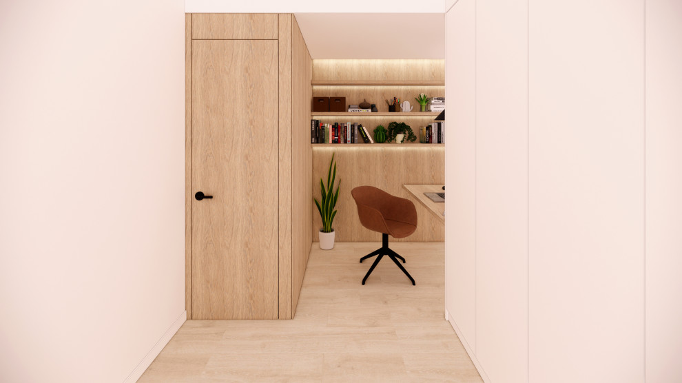 Design ideas for a small scandinavian study room in Barcelona with white walls, light hardwood floors, a built-in desk and panelled walls.