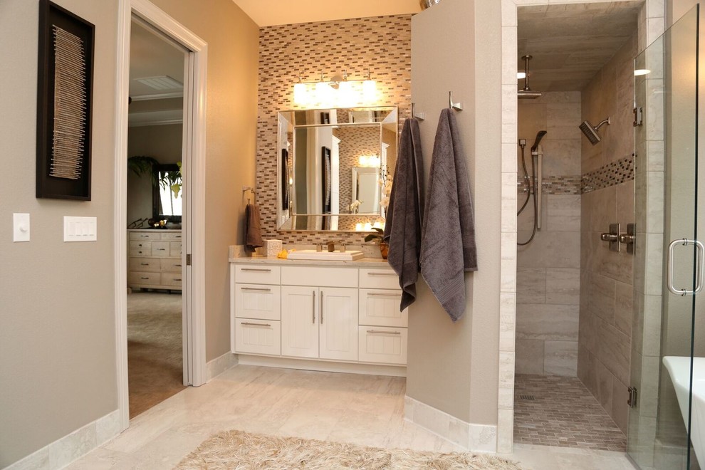Design ideas for a mid-sized transitional master bathroom with louvered cabinets, white cabinets, a freestanding tub, an alcove shower, black and white tile, gray tile, matchstick tile, beige walls, porcelain floors, a drop-in sink and granite benchtops.