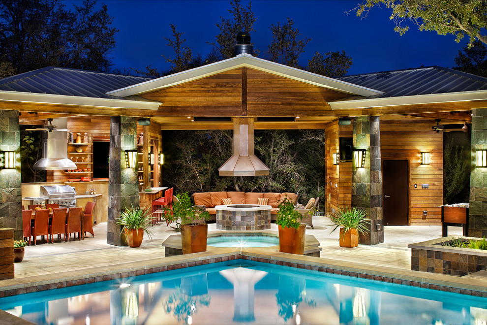 Design ideas for an expansive transitional backyard patio in Austin with concrete pavers and a gazebo/cabana.