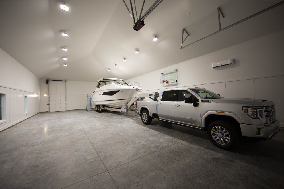 Inspiration for an expansive traditional detached four-car garage in Indianapolis.