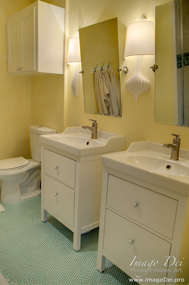 Inspiration for a small transitional kids bathroom in Houston with an integrated sink, flat-panel cabinets, white cabinets, solid surface benchtops, a drop-in tub, a shower/bathtub combo, a two-piece toilet, green tile, ceramic tile, yellow walls and ceramic floors.