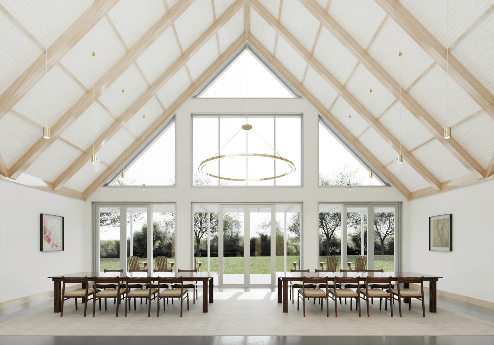 Inspiration pour une grande salle à manger ouverte sur le salon design en bois avec un mur blanc, sol en béton ciré, un sol gris et un plafond voûté.