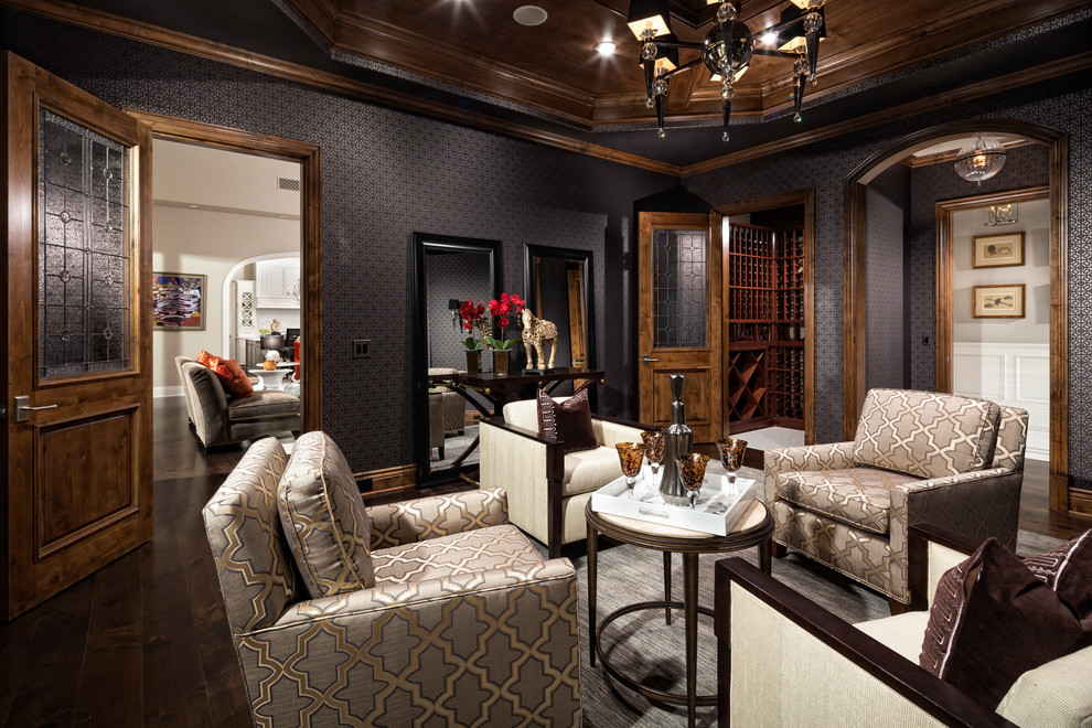 Mediterranean formal enclosed living room in Los Angeles with dark hardwood floors and black walls.