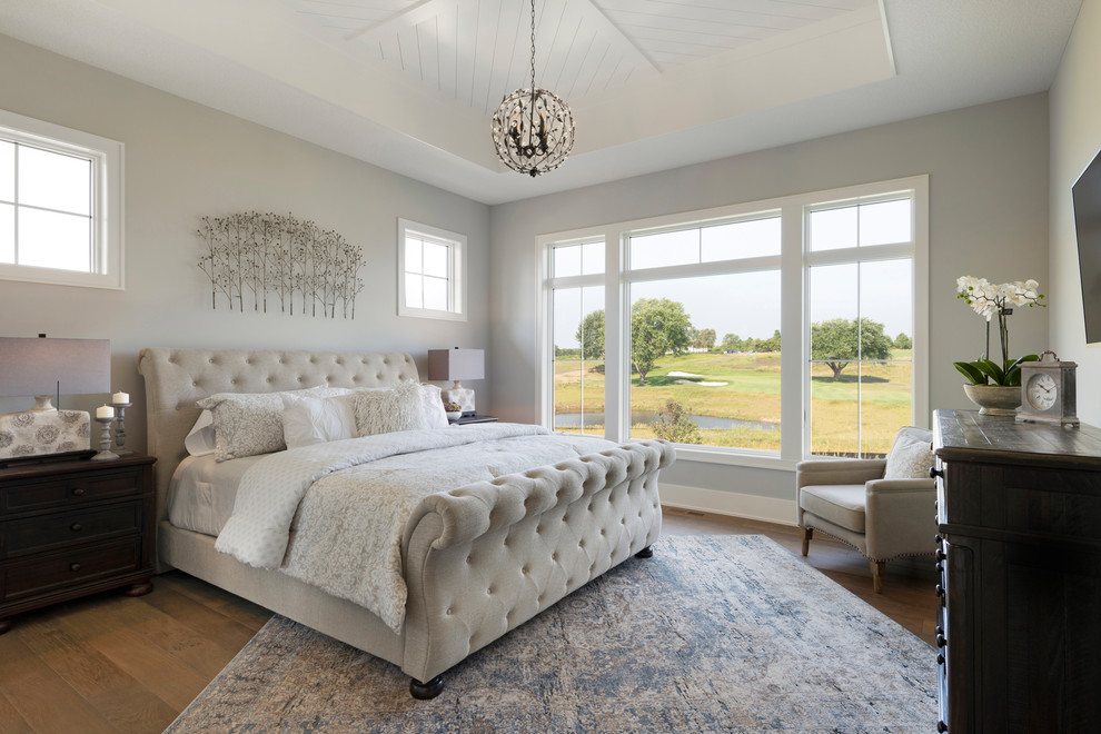 Bedroom - country dark wood floor and brown floor bedroom idea in Minneapolis with gray walls