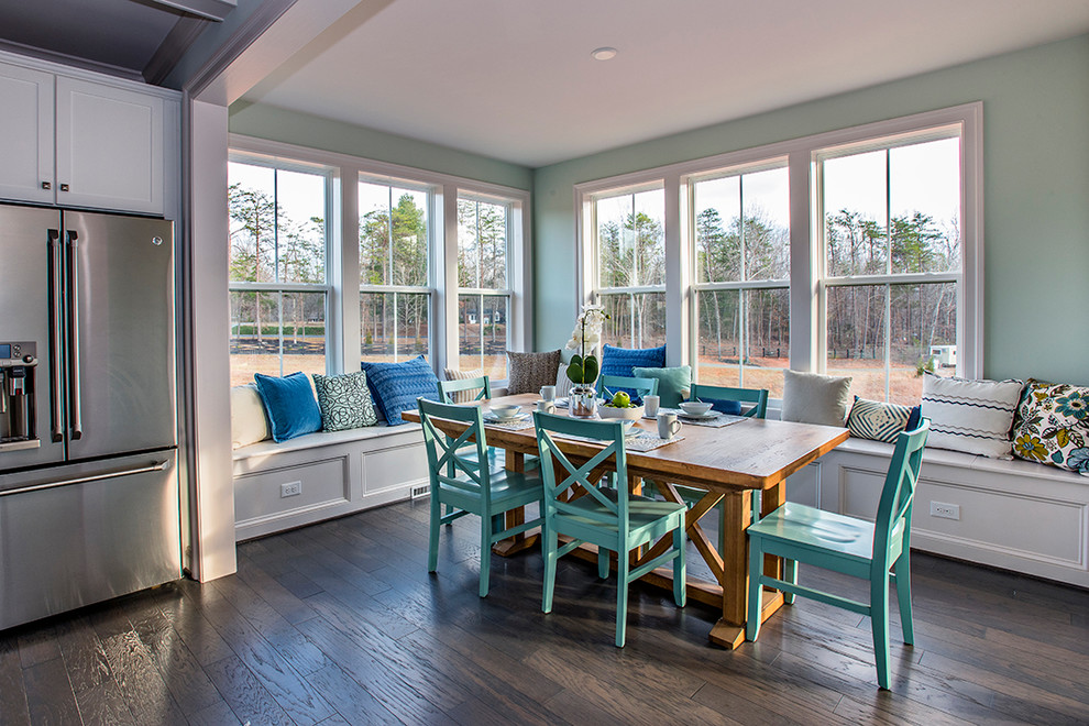Example of a beach style dark wood floor kitchen/dining room combo design in DC Metro with blue walls