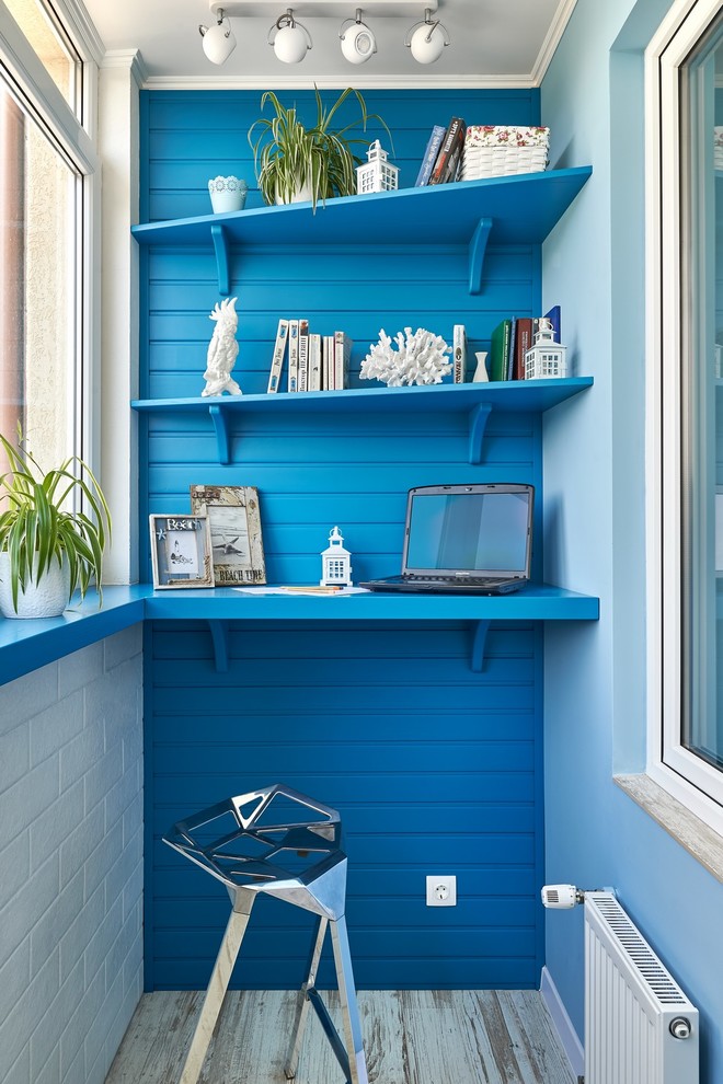This is an example of a beach style home office in Other.