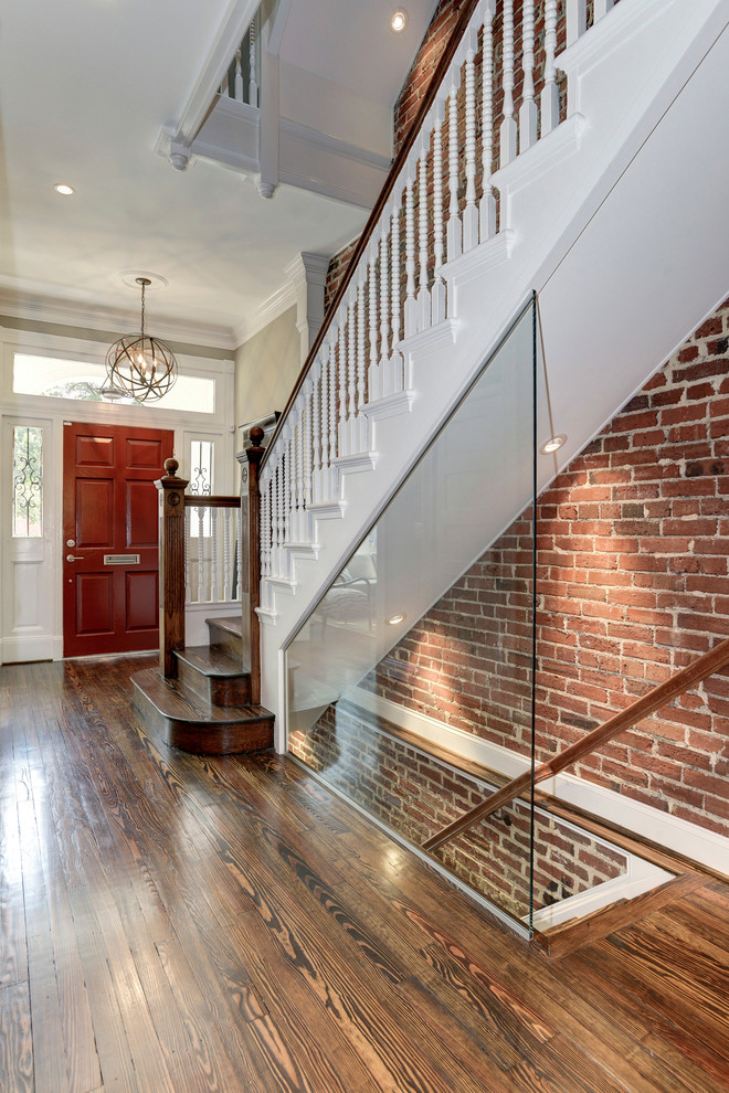 Large modern foyer in DC Metro with medium hardwood floors, a single front door and a red front door.