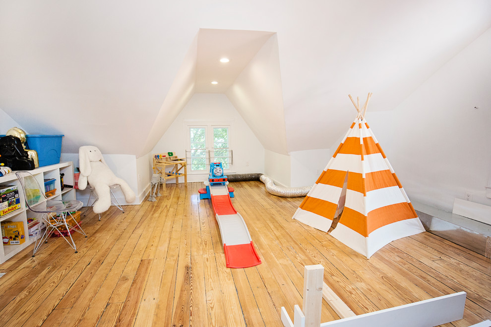 Mid-sized contemporary kids' playroom in Baltimore with yellow walls, light hardwood floors and brown floor.