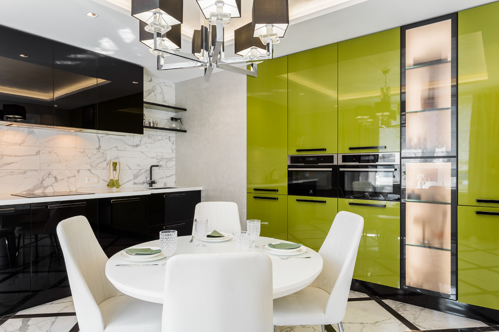 Inspiration for a large contemporary l-shaped eat-in kitchen in Other with an undermount sink, green cabinets, solid surface benchtops, white splashback, ceramic splashback, black appliances, porcelain floors, no island, white floor, white benchtop and flat-panel cabinets.