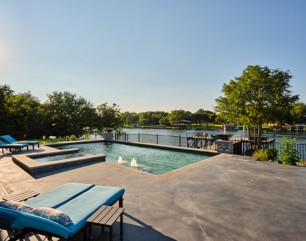 Design ideas for an expansive contemporary swimming pool in Austin.