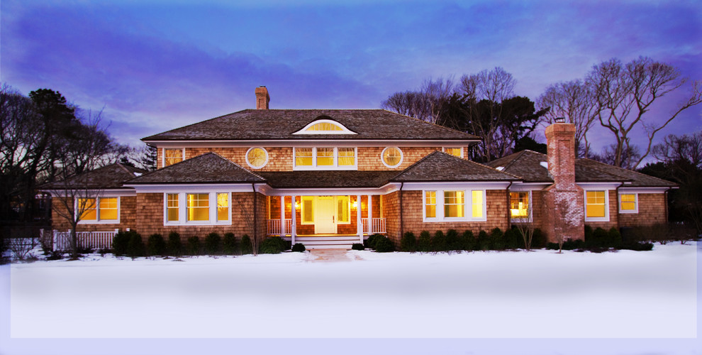 Large transitional beige two-story wood gable roof idea