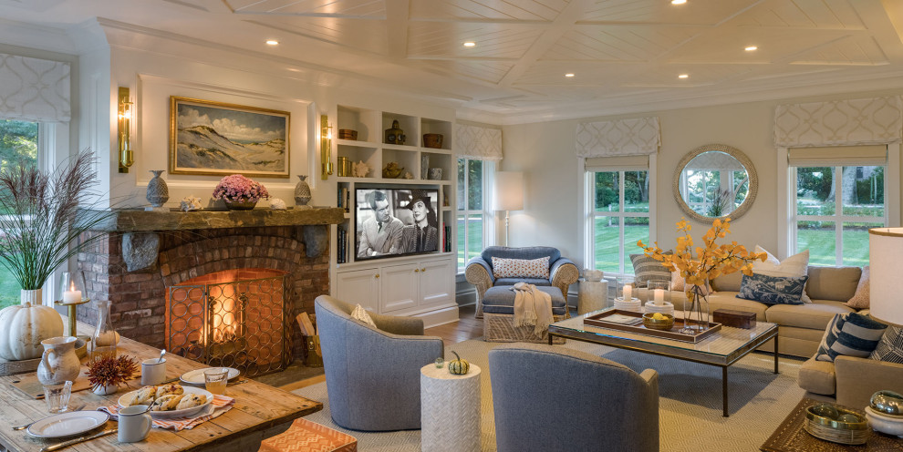 Photo of an expansive beach style living room in Boston with no fireplace, a brick fireplace surround and a built-in media wall.