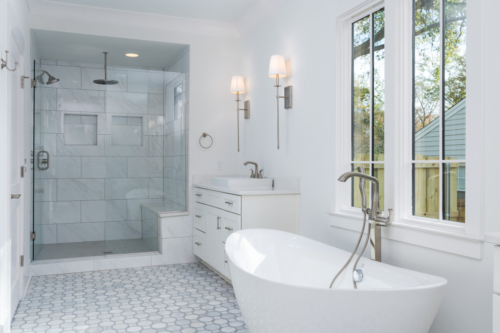 Inspiration for a large country master gray tile and porcelain tile mosaic tile floor, multicolored floor and single-sink bathroom remodel in Birmingham with white cabinets, a one-piece toilet, white walls, a pedestal sink, quartzite countertops, a hinged shower door, multicolored countertops and a built-in vanity