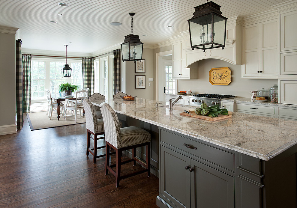 Inspiration for a large traditional galley eat-in kitchen in Philadelphia with dark hardwood floors, a double-bowl sink, shaker cabinets, white cabinets, granite benchtops, beige splashback, stainless steel appliances, with island and brown floor.