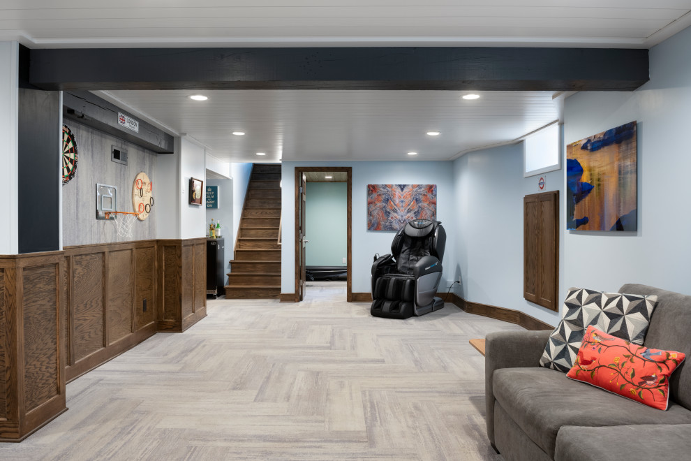 This is an example of a medium sized contemporary fully buried basement in Minneapolis with panelled walls, blue walls, carpet, grey floors and a wood ceiling.