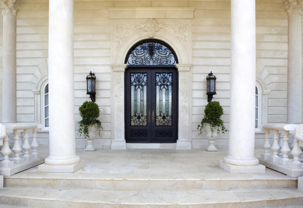 Inspiration for an expansive traditional front door in DC Metro with beige walls, a double front door and a black front door.