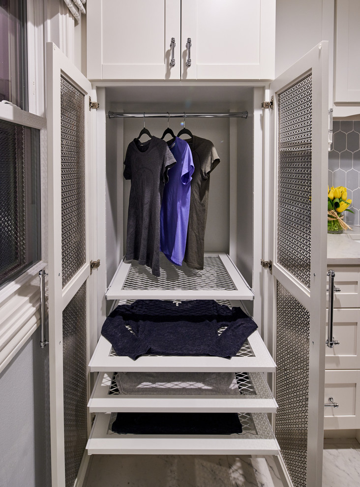 Photo of a transitional laundry room in Austin.