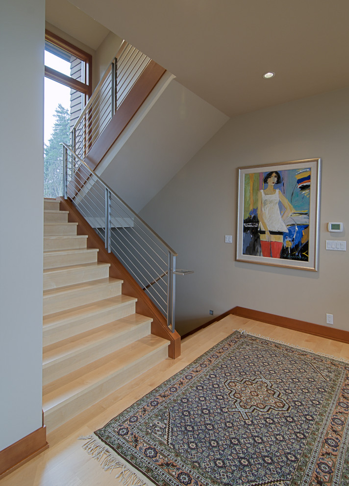 Photo of a contemporary wood staircase in Portland with wood risers.