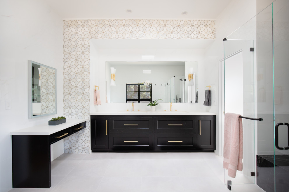 Photo of a transitional master bathroom in San Francisco with shaker cabinets, black cabinets, a curbless shower, multi-coloured tile, an undermount sink, engineered quartz benchtops, a hinged shower door, white benchtops, a double vanity and a built-in vanity.
