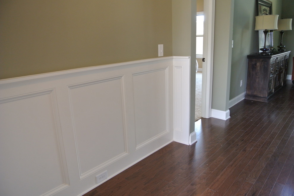 Photo of a mid-sized traditional hallway in Atlanta with grey walls and medium hardwood floors.
