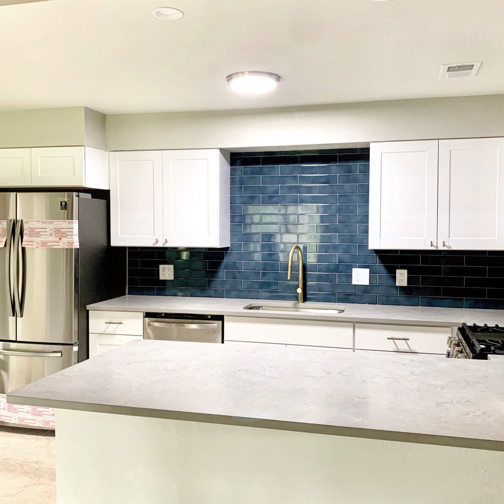 Inspiration for a small transitional u-shaped ceramic tile, beige floor and wood ceiling eat-in kitchen remodel in Austin with a single-bowl sink, shaker cabinets, white cabinets, quartz countertops, blue backsplash, porcelain backsplash, stainless steel appliances, a peninsula and gray countertops