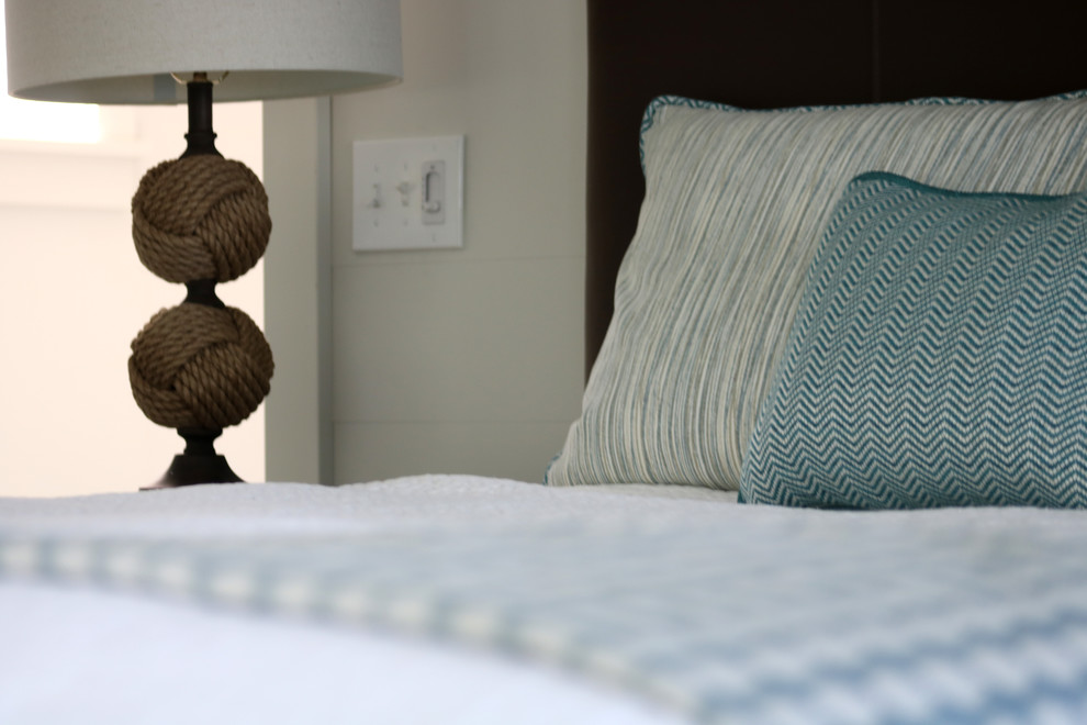 Transitional guest dark wood floor and gray floor bedroom photo with white walls