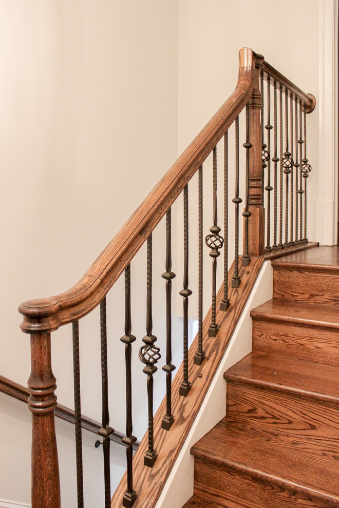 Design ideas for a large contemporary wood curved staircase in DC Metro with wood risers and mixed railing.