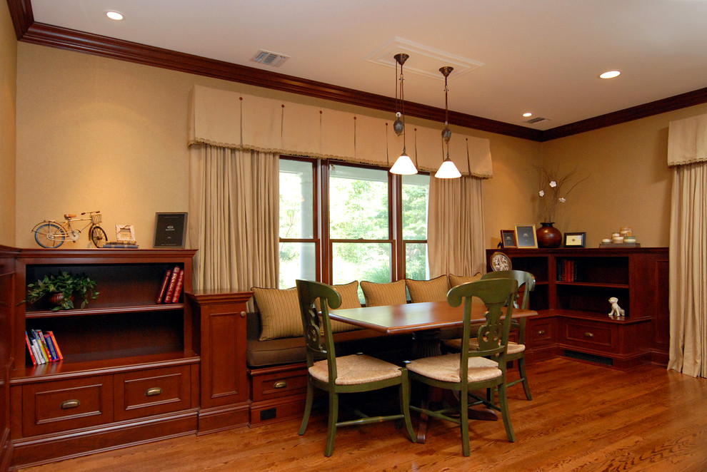 Traditional family room in New York with beige walls and medium hardwood floors.