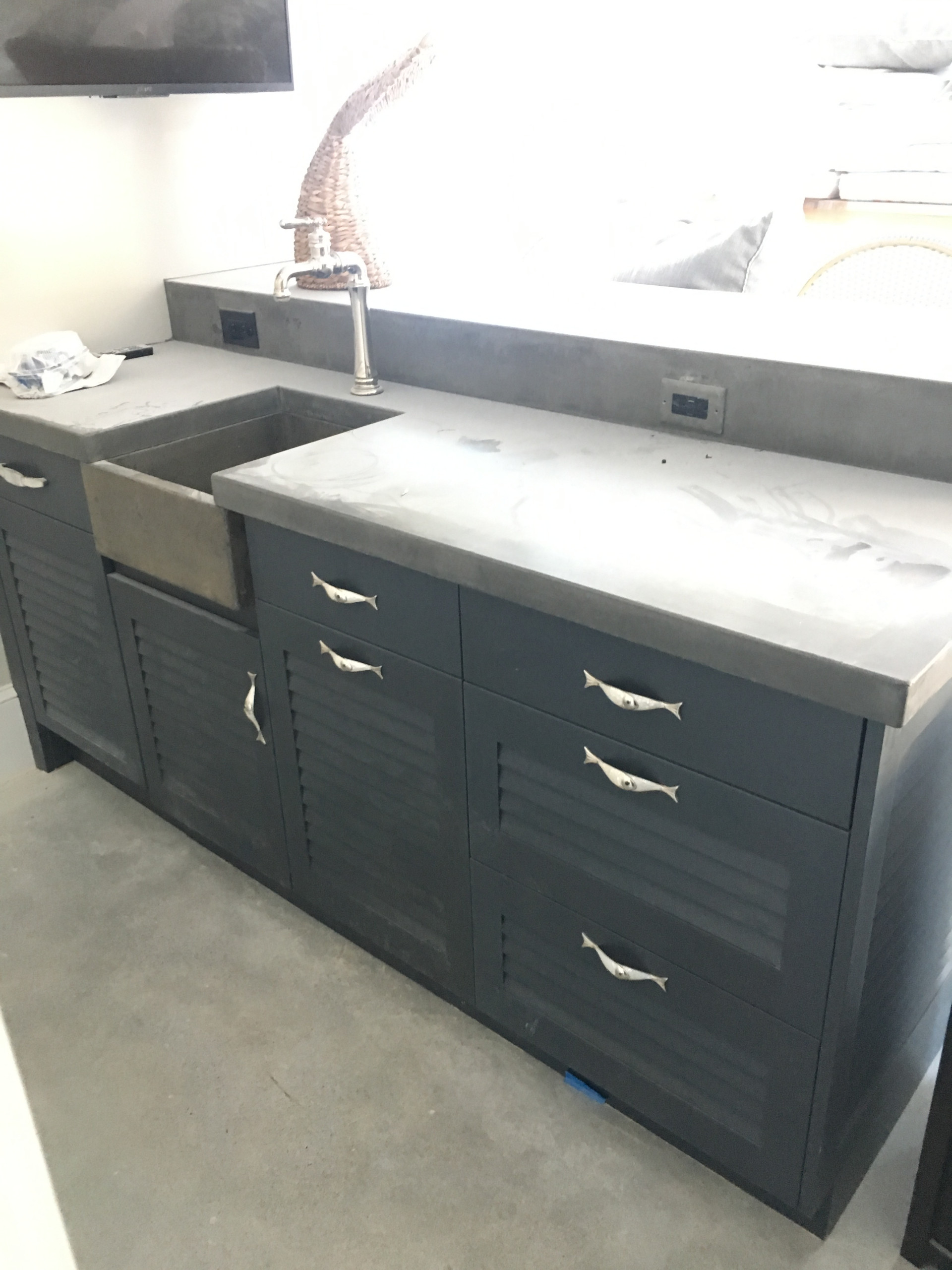 A fully equipped laundry room with a built ins