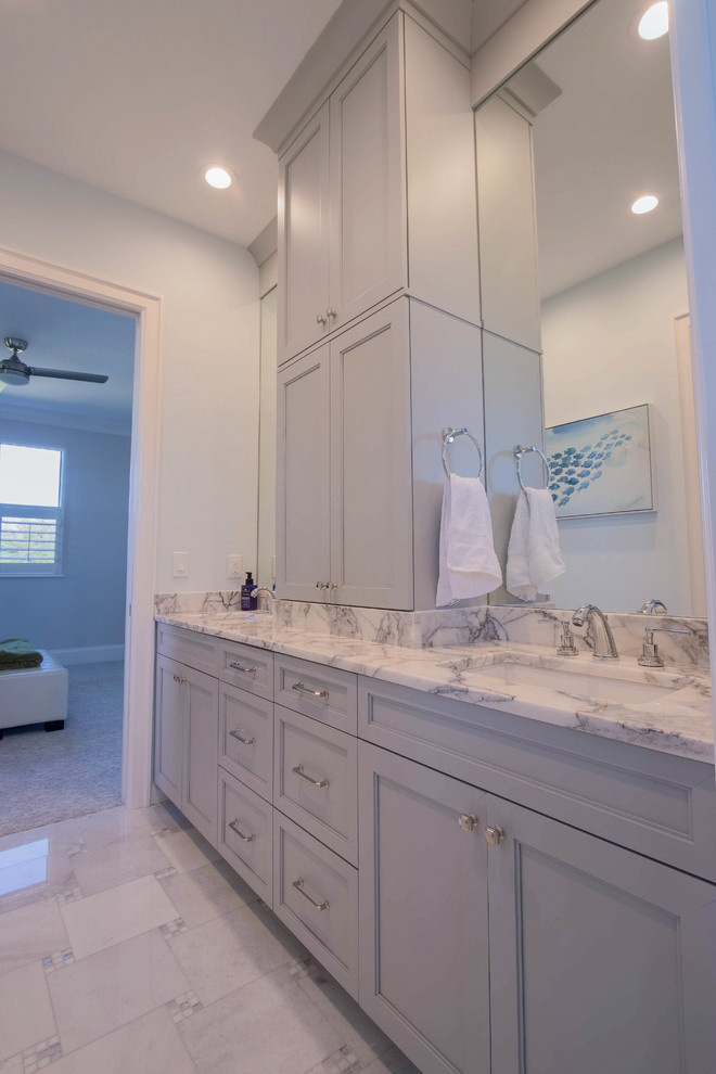 Mid-sized transitional kids bathroom in Other with shaker cabinets, grey cabinets, white tile, porcelain tile, blue walls, porcelain floors, an undermount sink, marble benchtops and white floor.
