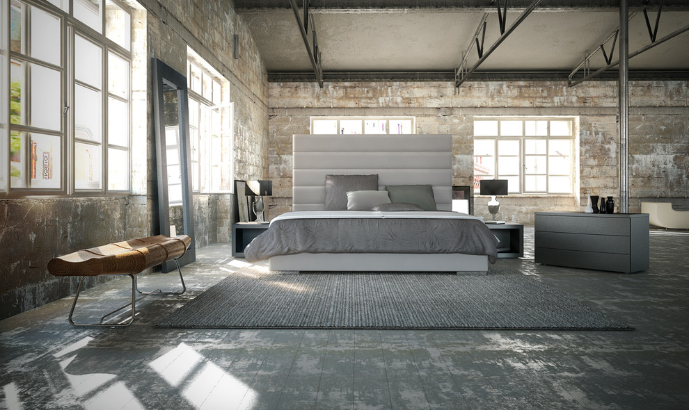 Photo of a large industrial loft-style bedroom in Los Angeles with grey walls and no fireplace.