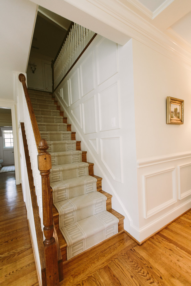Photo of a mid-sized traditional carpeted straight staircase in Baltimore with carpet risers.