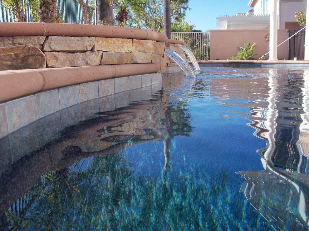 Example of an island style home design design in Orange County