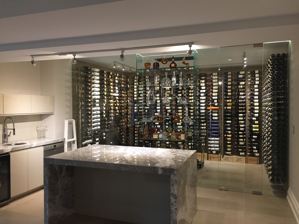 This is an example of a large contemporary wine cellar in Toronto with storage racks.