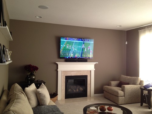 Wall decor for either side of the fireplace w/ mounted TV