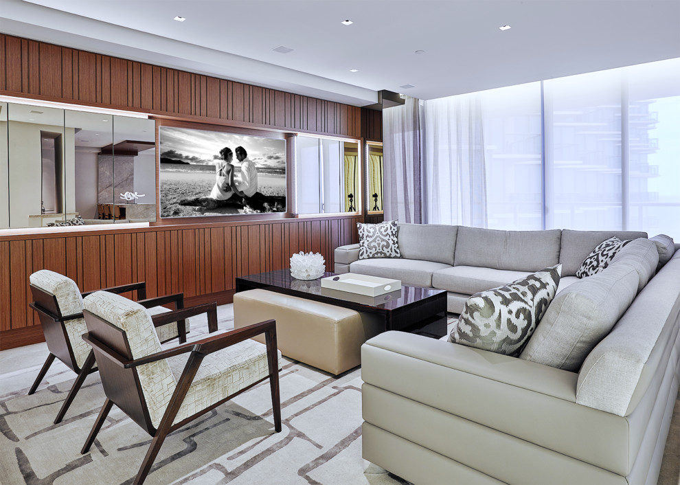 This is an example of a contemporary living room in Miami with no fireplace and a wall-mounted tv.